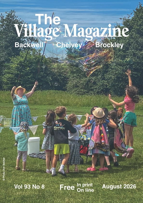 Magazine front cover for August 2026, featuring children on the playing fields watching Backwell's bubble lady, Helen